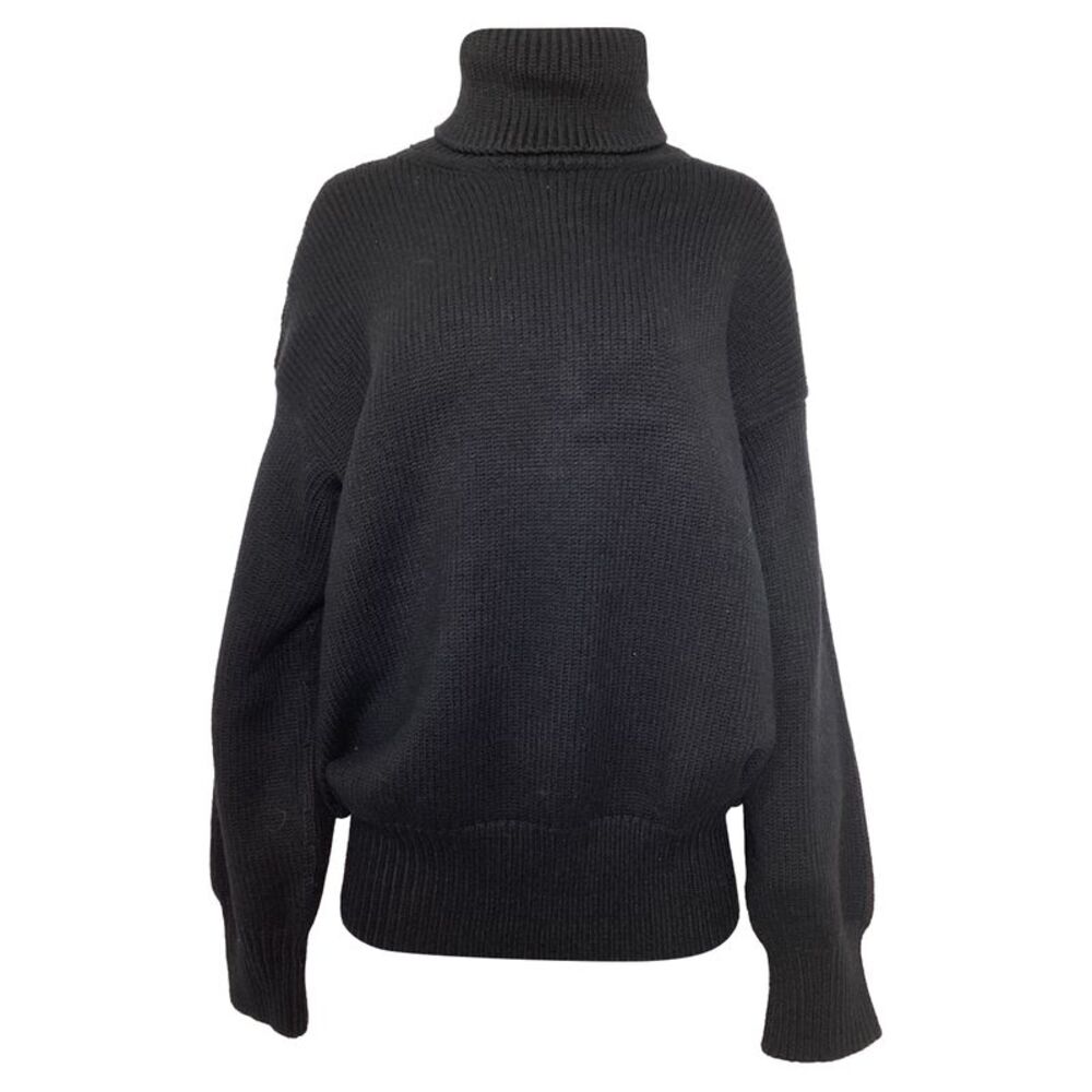 The Row Turtleneck Sweater in Black Merino Wool